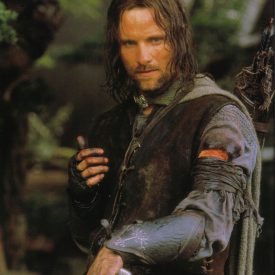 Aragorn (Viggo Mortensen) wearing Boromir's gauntlets in The Fellowship of the RIng (Lord of the Rings)