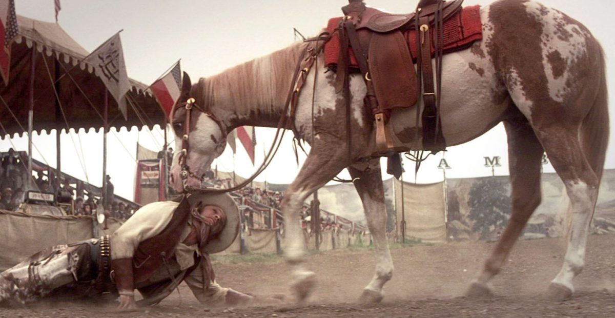 Hidalgo drags Frank (Viggo Mortensen) from the arena