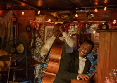 Mahershala Ali as Don Shirley playing piano in Green Book